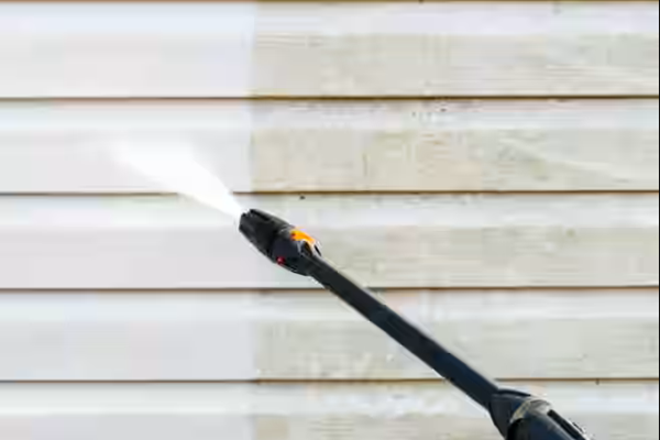 pressure-washer-cleaning-outside -of-house