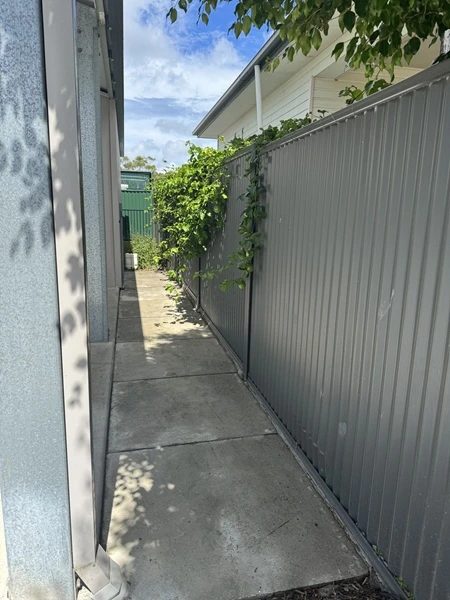 down the side of Redlands Coast property after cleaning the concrete