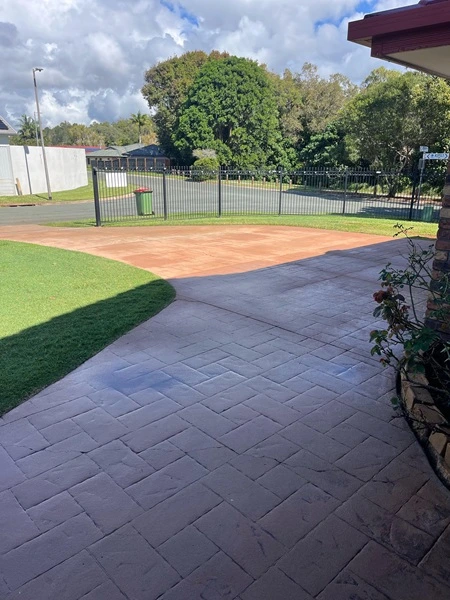 patterned concrete driveway before cleaning
